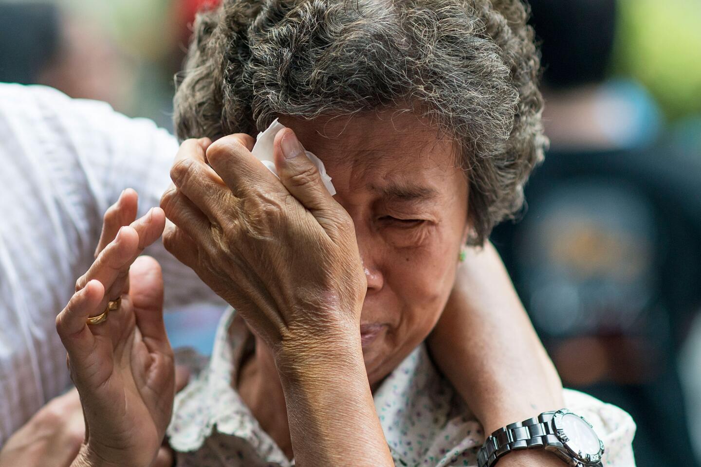 Relatives of Malaysia jet passengers scuffle with police in